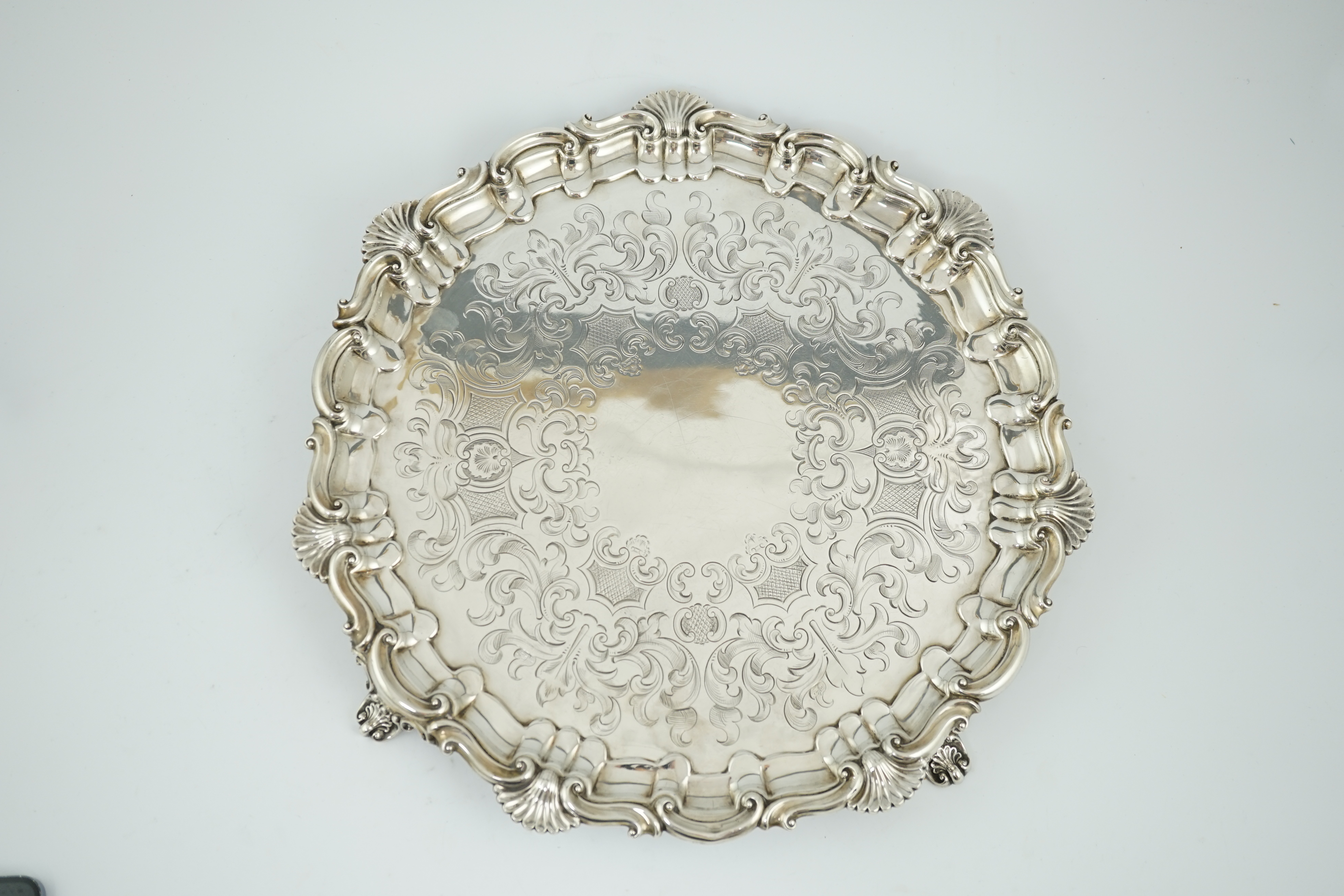 A large Victorian engraved silver salver, by Henry Wilkinson & Co